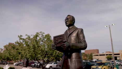 statue of auto pioneer david buick in flint, michigan with gimbal video circling around