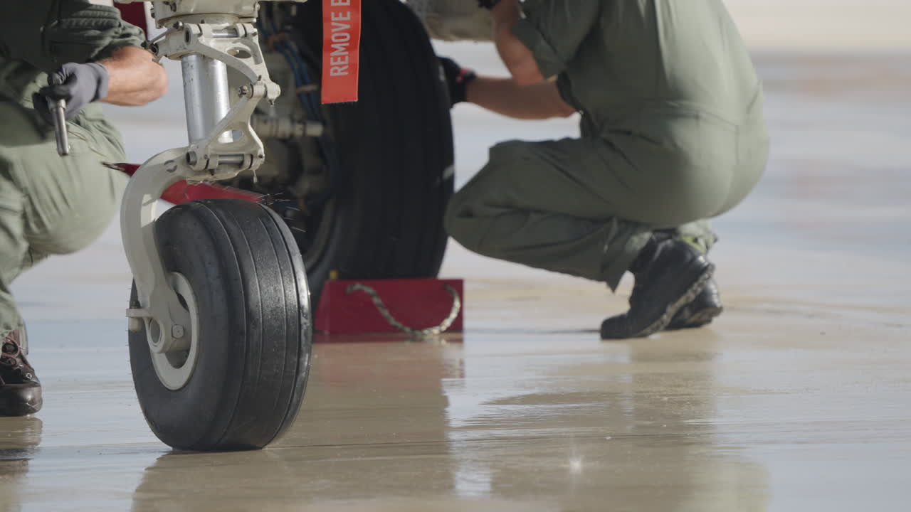 Aircraft landing gear and pilot on the tarmac