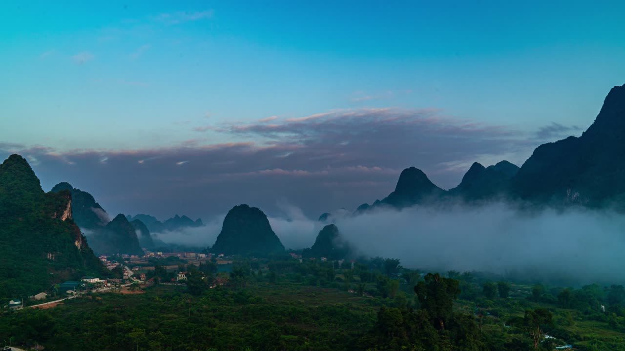 Time-Lapse Misty Sunrise View Around Limestone Cliffs and Mountain Tops at Ban Gioc Waterfall along the Quay Son River, Vietnam