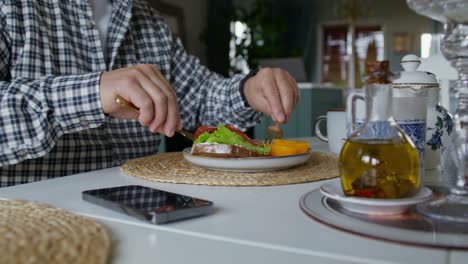 man eating breakfast at home