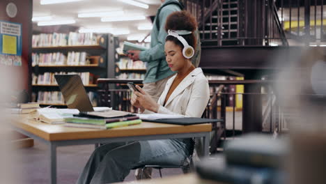 student studying in library