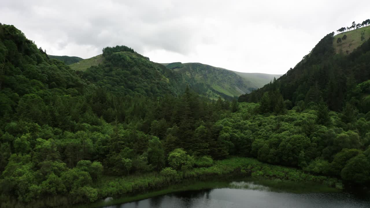 Drone shot soaring over one of Ireland's rural lakes.