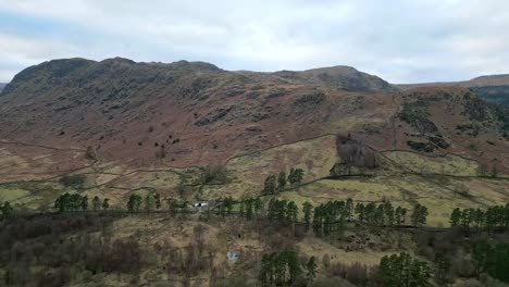 Aerial-drone-footage-of-Lakeland-fells-with-narrow-country-road