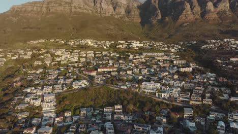 aerial view of cape town's residential area with lions head mountain in the background