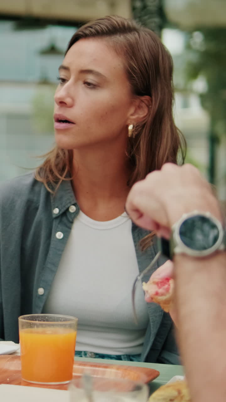 Lunch communication. International friends eating, talking and laughing. Focus