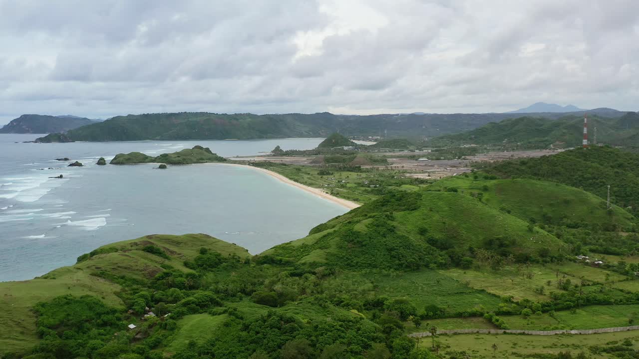 wide panoramic landscape of Bukit Merese hills coastline in Lombok Indonesia on cloudy day