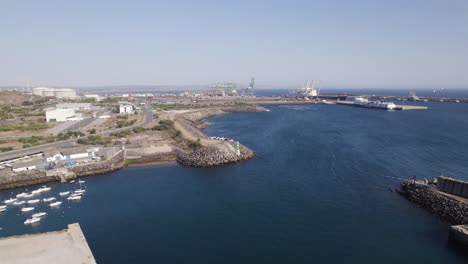 International-logistics-harbour-in-Sines,-Portugal,-aerial-backward,-copyspace