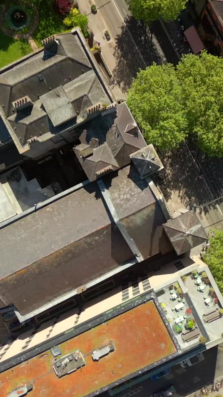 Descending social aerial video of St Ann's Church in Dublin City Centre, Ireland on a bright and sunny day. Filmed in 1080x1920, 60FPS and with Rec709 color