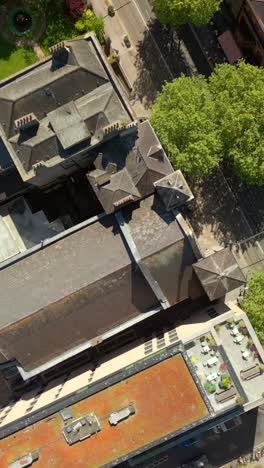 descending social aerial video of st ann's church in dublin city centre, ireland on a bright and sunny day. filmed in 1080x1920, 60fps and with rec709 color
