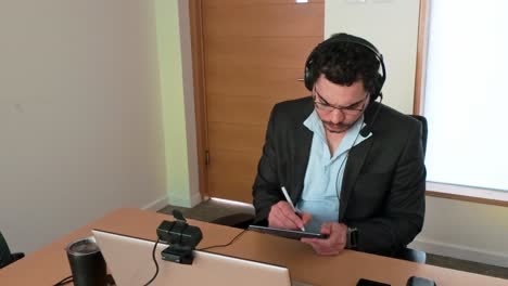 team brainstorm: man with tablet and headset