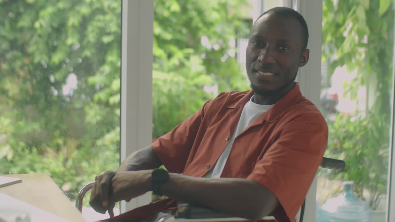 Portrait of Cheerful Black Man in Wheelchair