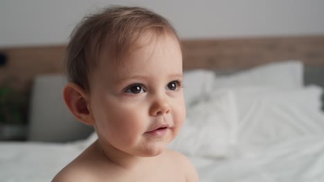 video of close up caucasian baby after the bath.