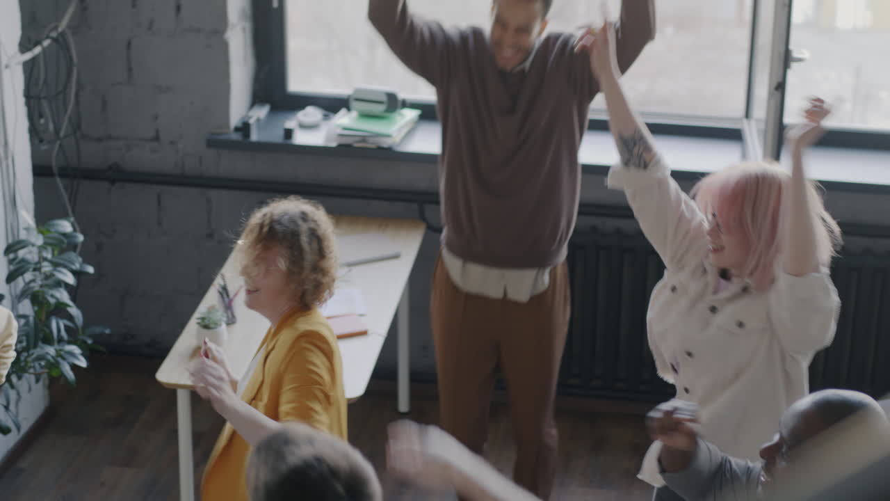 Team Celebrating in Office