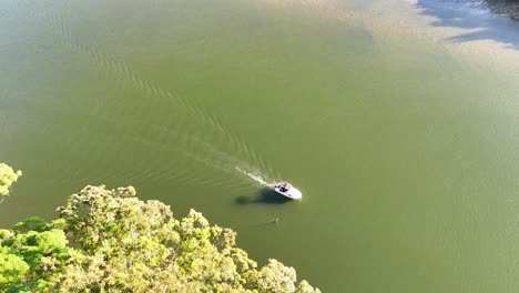 a boat travels along a scenic river