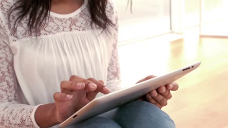 pretty woman using tablet at home