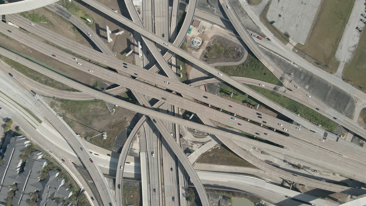Top Down aerial view of the massive freeway interchange at I69 and I610 in Houston Texas. Birdseye Drone Shot of the biggest highway intersection Houston. Interstate 69 and Interstate 610 interchange.