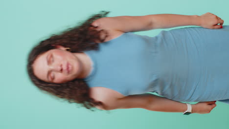 Funny comical woman making silly facial expressions and grimacing fooling around showing tongue
