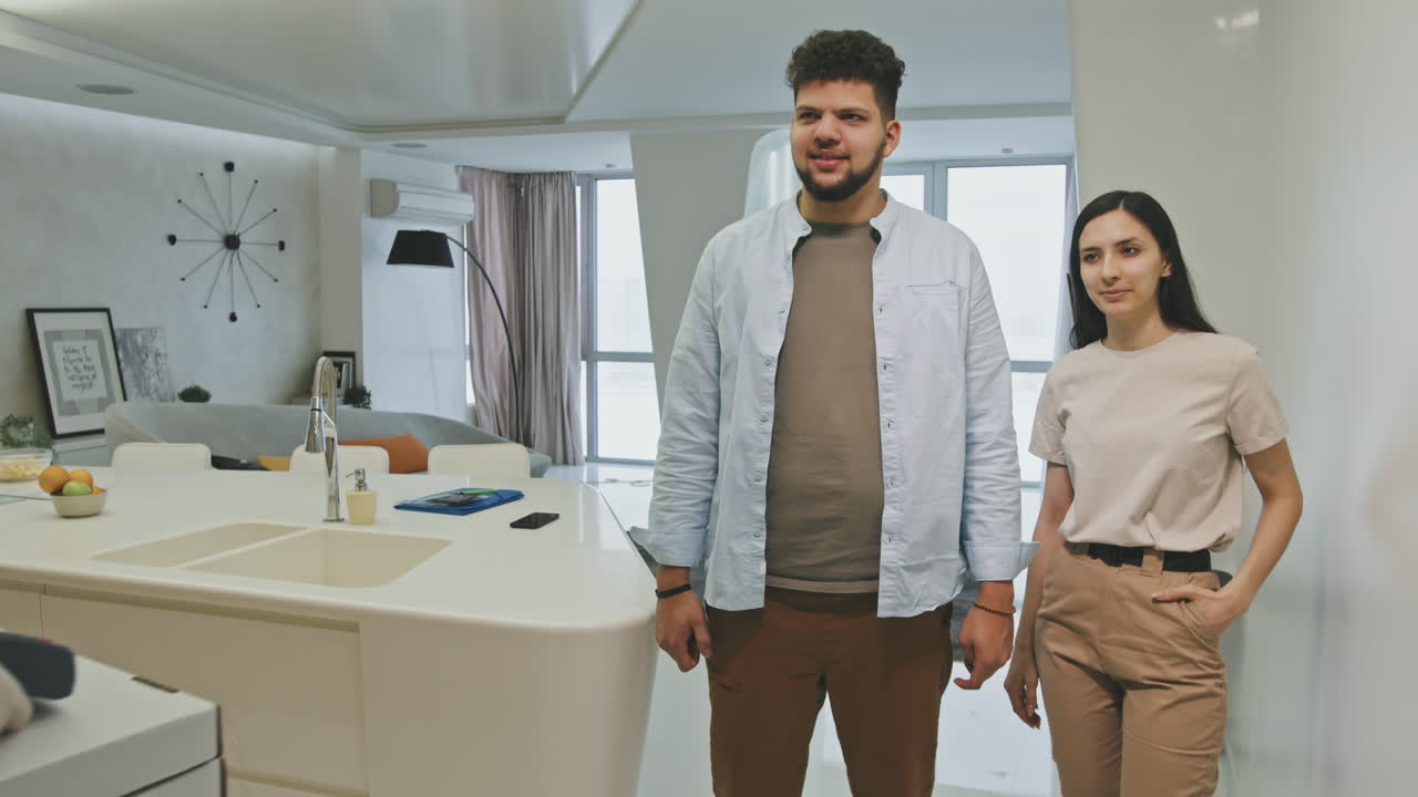 Young Latin Couple Getting Pizza Delivery