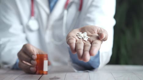 doctor holding pills