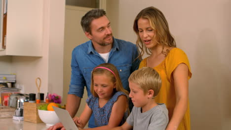 cute family using the laptop
