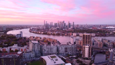 beautiful drone shot london docklands and canary wharf at sunset