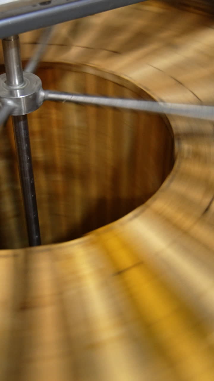 Working machine for honey extraction with frames inside. Special equipment for harvesting organic product at apiary farm. Vertical video