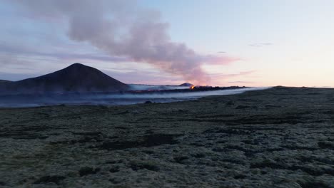 soaring low above ground towards fissure volcano eruption in iceland