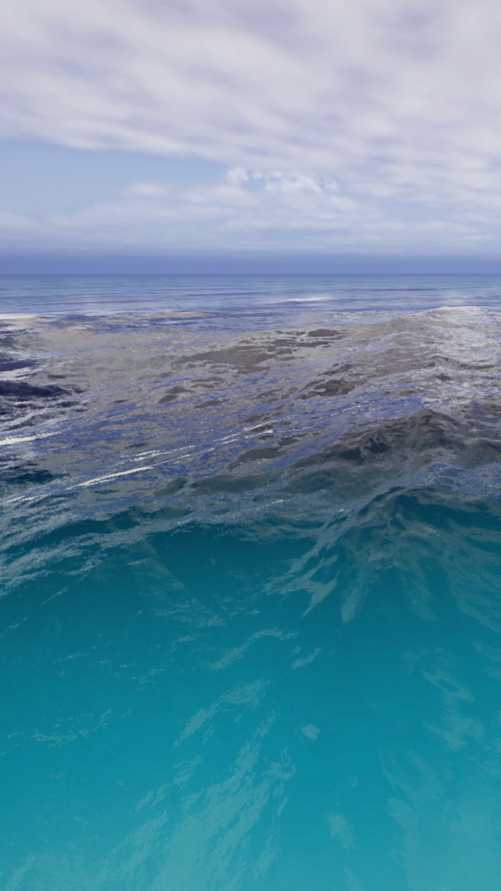 Majestic ocean waves dance under a sky filled with soft clouds