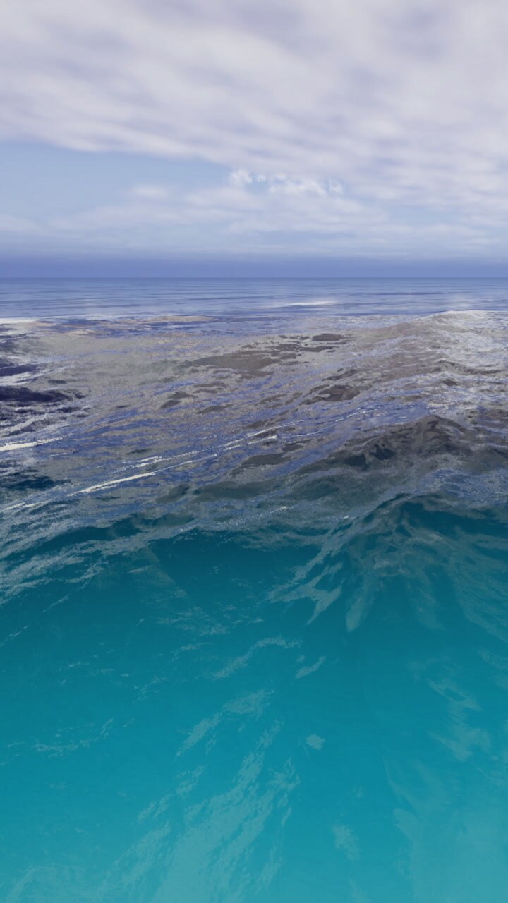 Majestic ocean waves dance under a sky filled with soft clouds