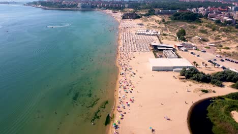 4K-moving-forward-drone-clip-over-an-exotic-golden-sand-beach-in-Sunny-Beach,-Bulgaria