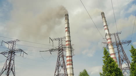 a pipe of a chemical plant billowing thick black smoke 2