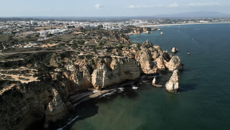 wide drone angle of a sunny day close to lagos, portugal