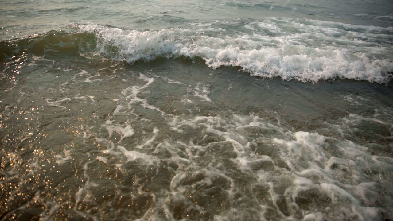Waves crashing on smoky beach. Oregon coast