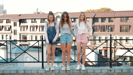 three young women having fun in the city