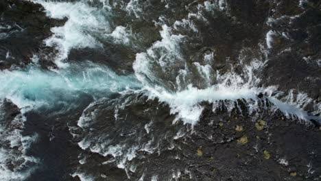 aerial top-down view of bruarfoss waterfall with turquoise water, south iceland