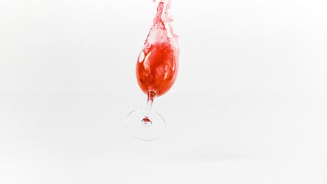 Breaking-the-glass-of-red-wine-in-slow-motion-on-white-background.-Shot-on-super-slow-motion-camera-1000-fps.