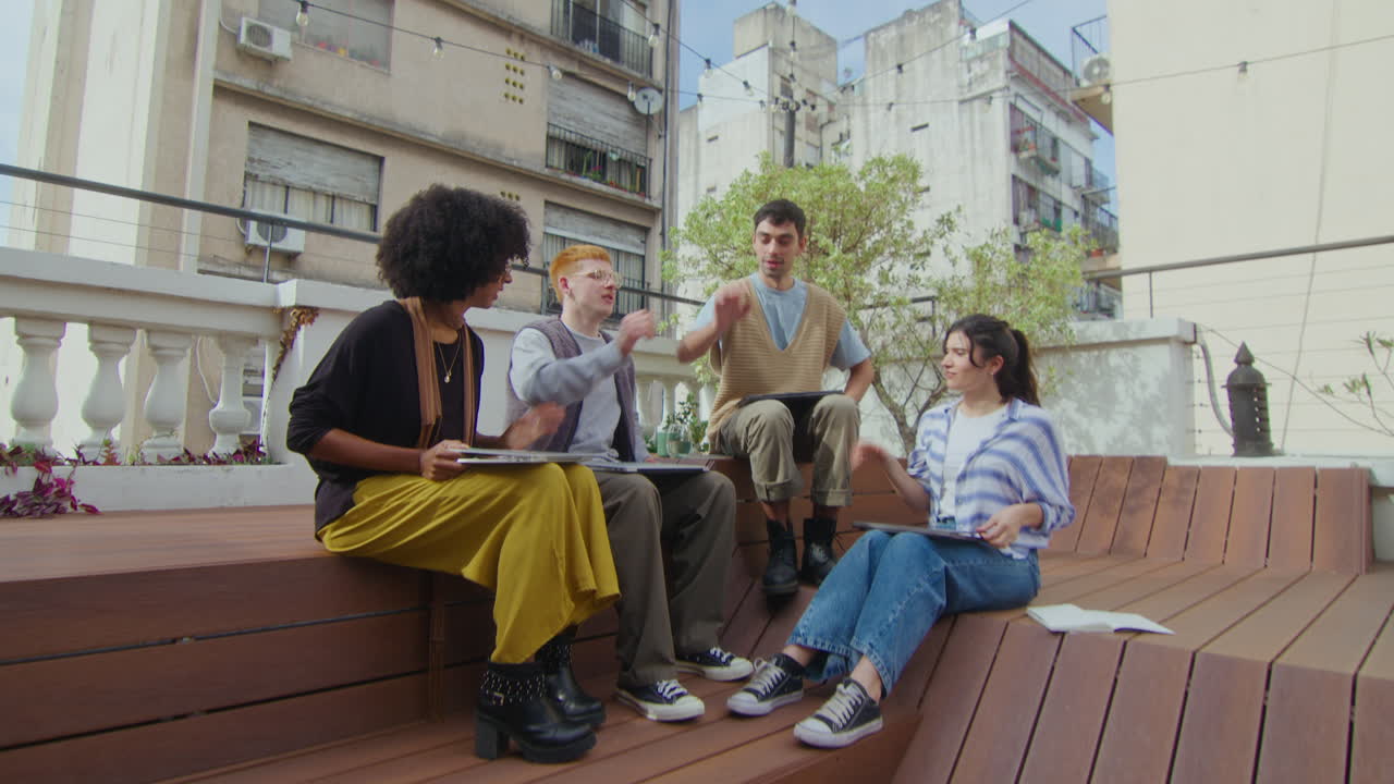 Cheerful Gen Z Business Team Hand Stacking at Outdoor Coworking Space