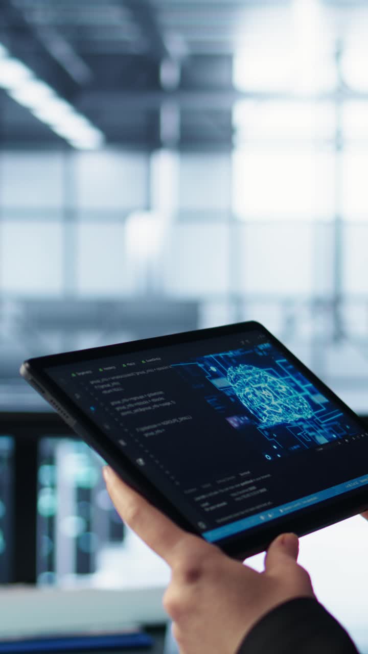 Vertical video Engineer in data center with tablet integrating AI driven automation tools