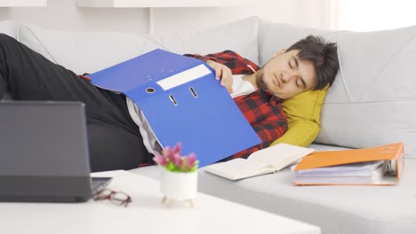 lazy man falls asleep while doing work.