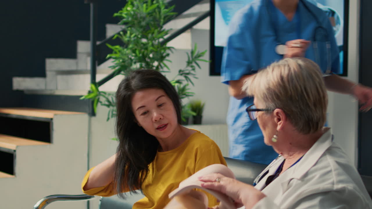 Medical staff assisting patient with neck brace