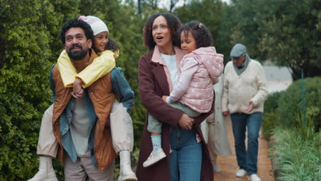 happy family walking through a park