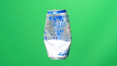 compressed can rotating on green screen background