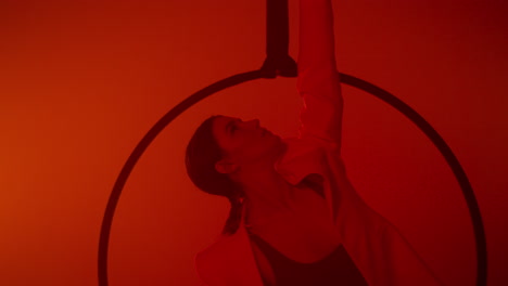 aerial hoop performance in red light