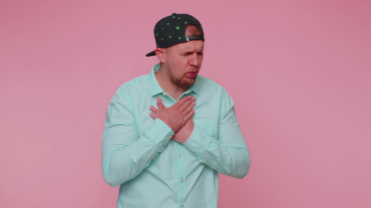 Unhealthy man covering mouth with hand, feeling sick, allergy or viral infection asthma symptoms