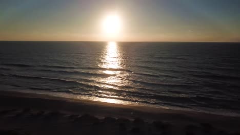 Aerial-drone-shot-of-the-beach-at-sunset-on-Captiva-Island,-Florida