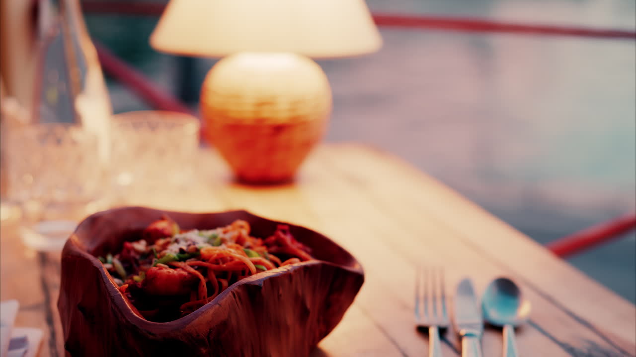 Close up view of a lamp on a set table at a restaurant near a port in the south of France