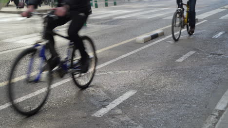 bike lane with cyclists circulating in the center of the city of valencia, spain