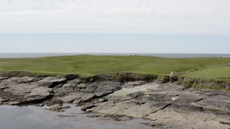 Aerial-ascends-over-Tramore-dunes-revealing-Atlantic-Ocean-off-Ireland