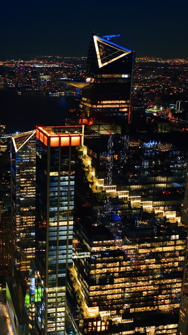 Rising above the splendid cityscape of New York. Night city view from drone footage.