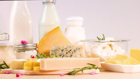 various dairy items displayed on a wooden surface